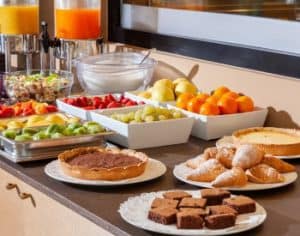 Continental Petite breakfast spread from Brendel’s Bagels in Long Island, NY, featuring an assortment of fresh-fruit, baked bagels, pie, buttery croissants, and pastries