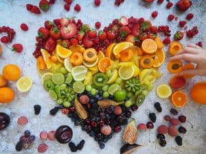 Colorful fruit heart display at Brendel’s Bagels in Long Island, NY, featuring a vibrant arrangement of fresh strawberries, pineapple, watermelon, grapes, and melon slices shaped into a large heart