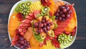 Vibrant fruit platter from Brendel’s Bagels in Long Island, NY, featuring an assortment of freshly sliced strawberries, pineapple, melon, grapes, beautifully arranged on a tray for catering, parties, and special events.